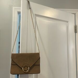 Banana Republic leather crossbody purse with gold chain strap and gold accent.